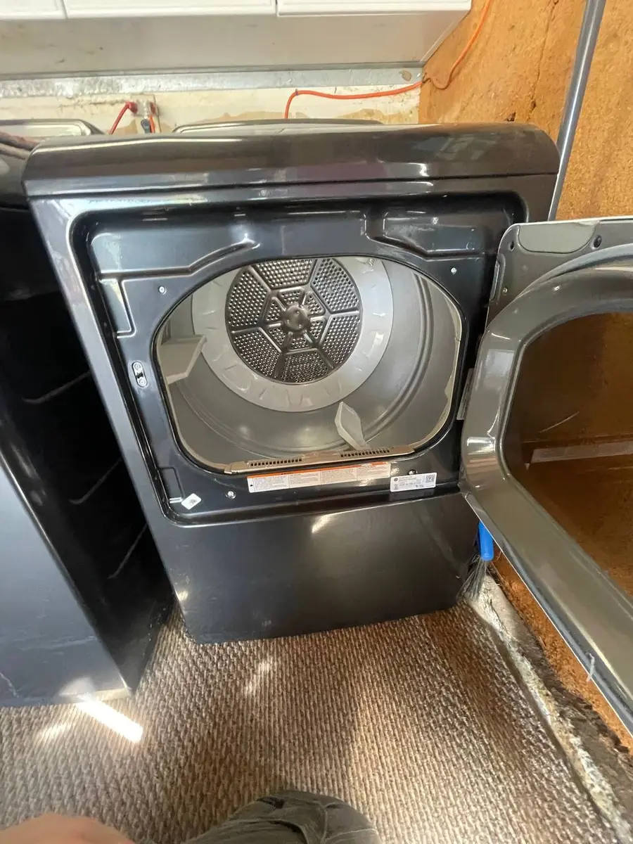Dryer with drum exposed during belt replacement — EasyBear technician repair