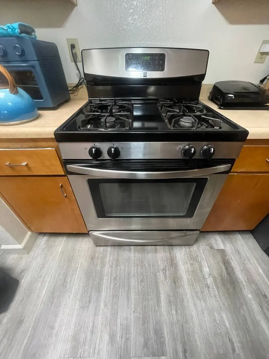 Stainless steel gas range in modern kitchen — EasyBear gas appliance repair