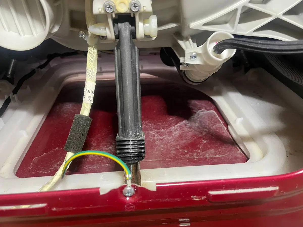 Washer heating element inspection during repair — EasyBear technician service