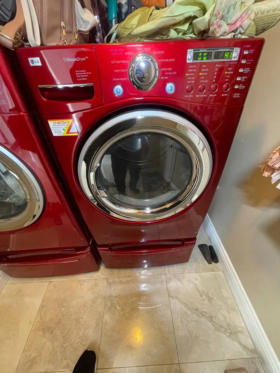 LG SteamDryer in red finish stacked in customer home — EasyBear service
