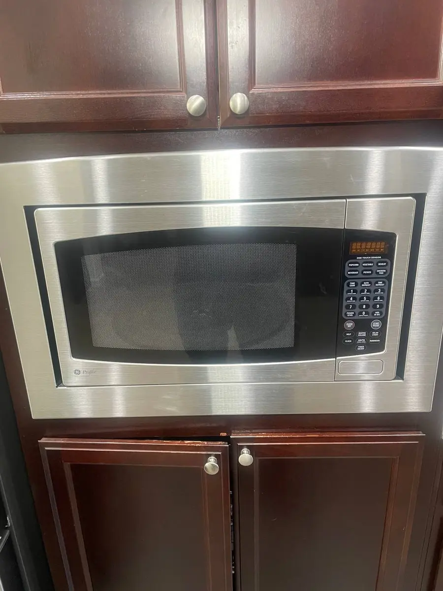 GE Profile built-in microwave in custom cabinetry — EasyBear service