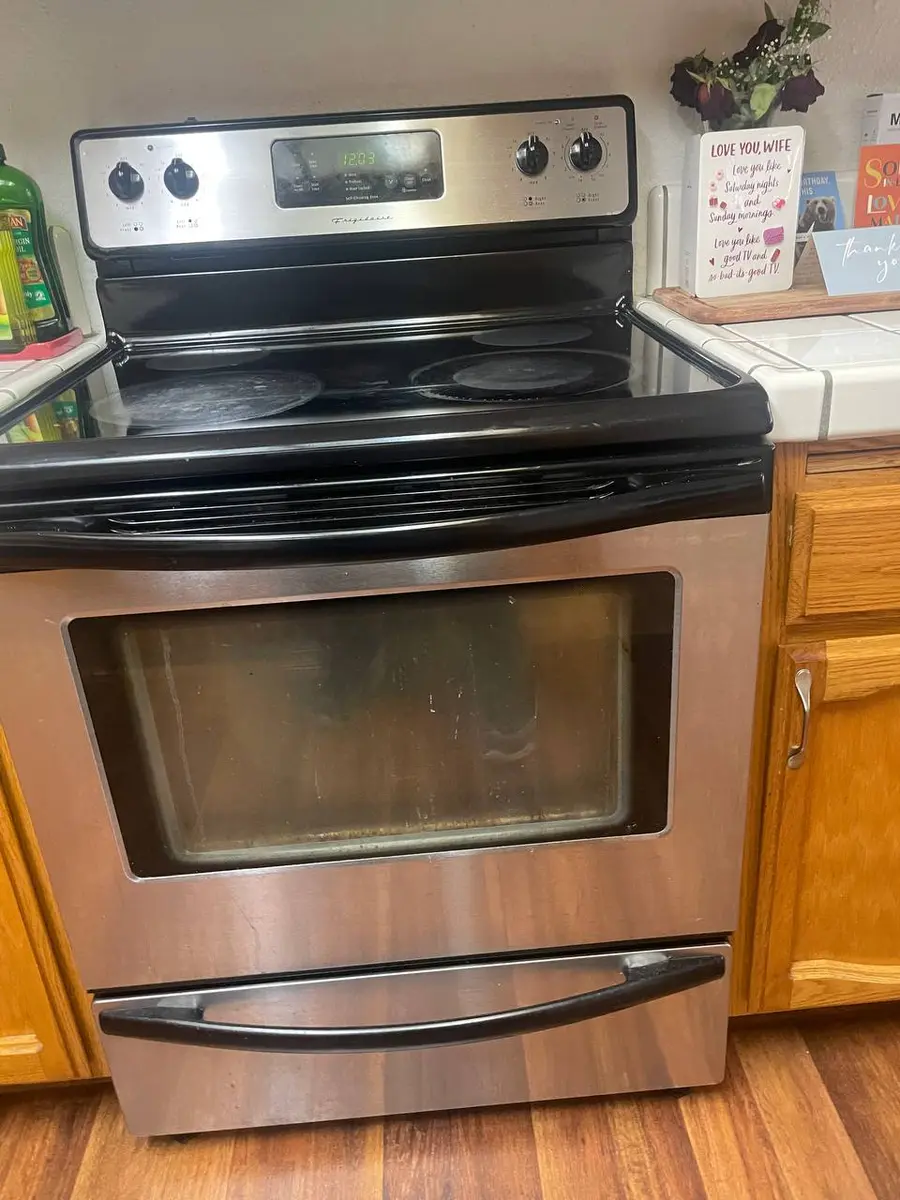 Frigidaire range at angle showing cooktop and oven — EasyBear service