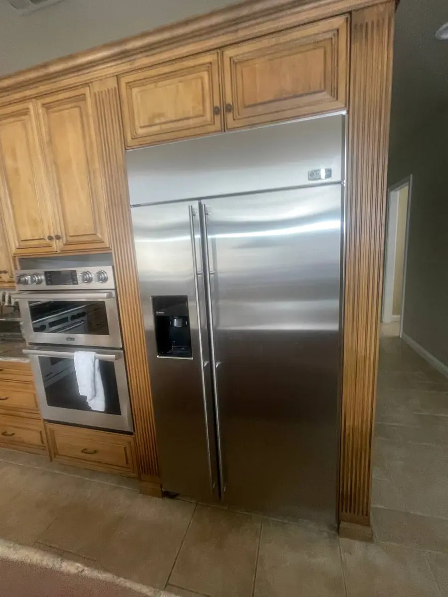 GE Monogram refrigerator in premium kitchen setting — EasyBear luxury repair