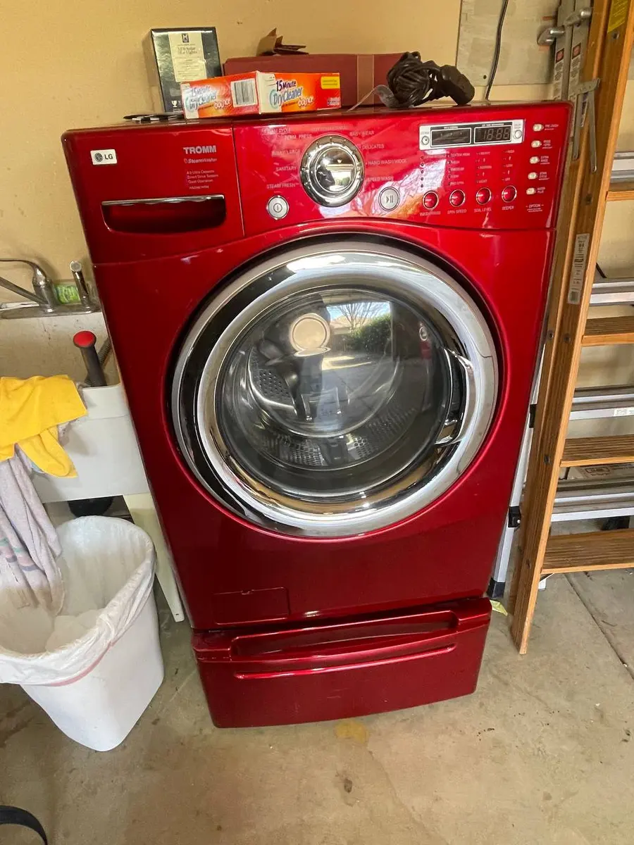 LG Tromm front-load washer in red installed in laundry room — EasyBear repair